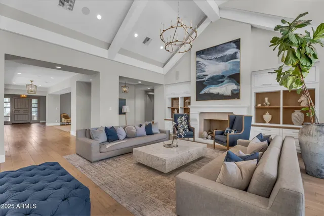 a large kitchen with cabinets wooden floor and stainless steel appliances