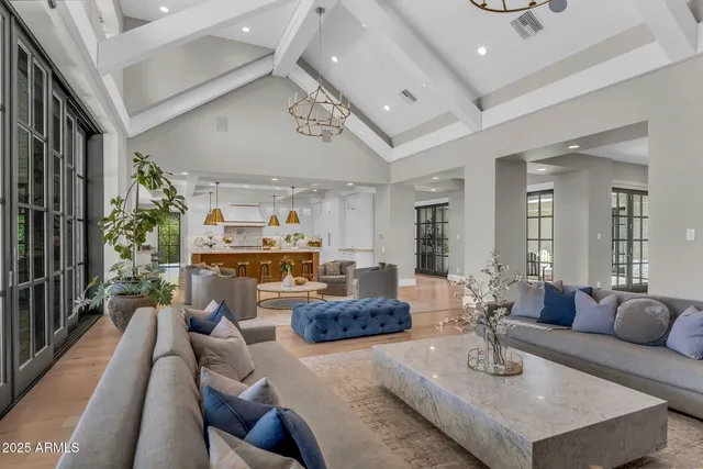 a large kitchen with stainless steel appliances kitchen island granite countertop a lot of counter space and a sink