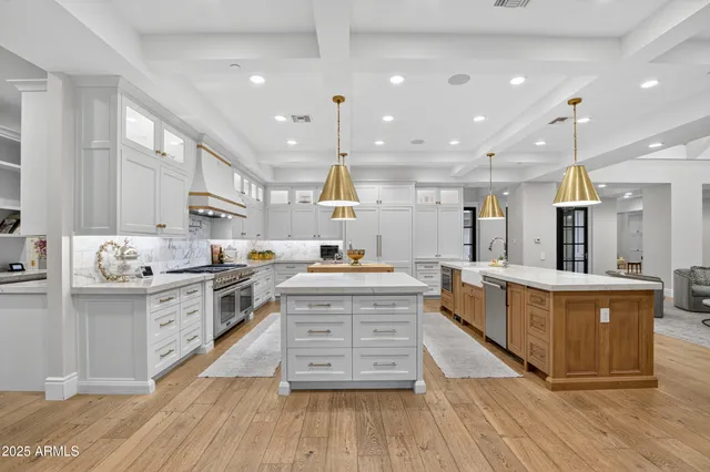 a bedroom with furniture and large windows