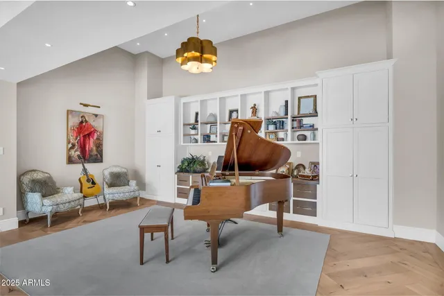 a bathroom with a double vanity sink toilet mirror and shower