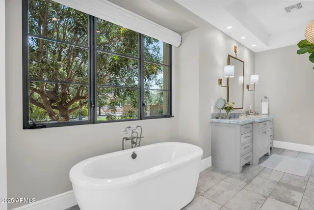 a bathroom with a double vanity sink and mirror