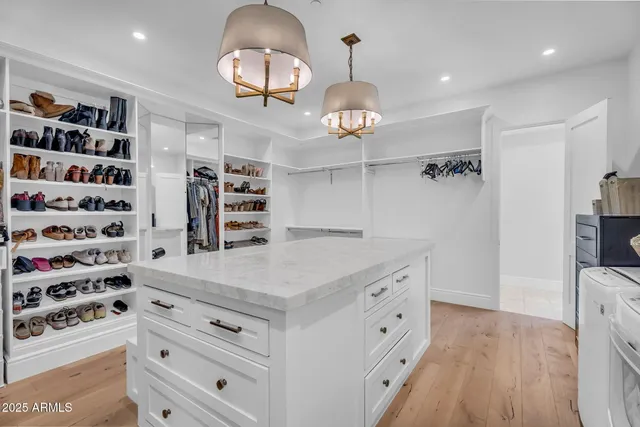 a bathroom with a granite countertop sink a mirror and a shower