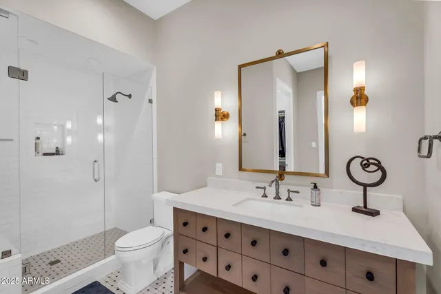 a bedroom with bed and a large window