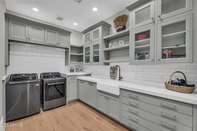 a kitchen with stainless steel appliances a refrigerator and a window