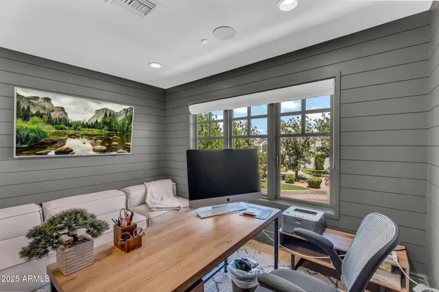 an aerial view of a house with yard and garage