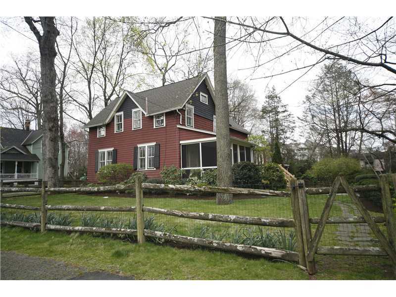 96 Rose Lane Darien, CT 06820 - Photo 19 of 23 a view of a house with a big yard and potted plants