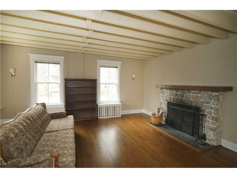 96 Rose Lane Darien, CT 06820 - Photo 5 of 23 a view of empty room with wooden floor and fireplace