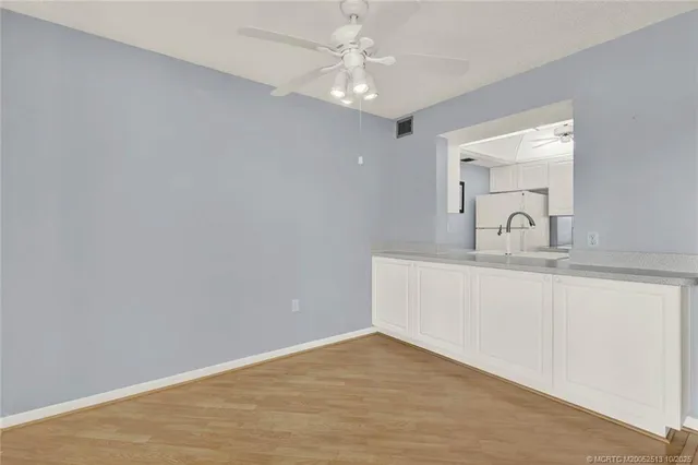 a bathroom with a sink and vanity