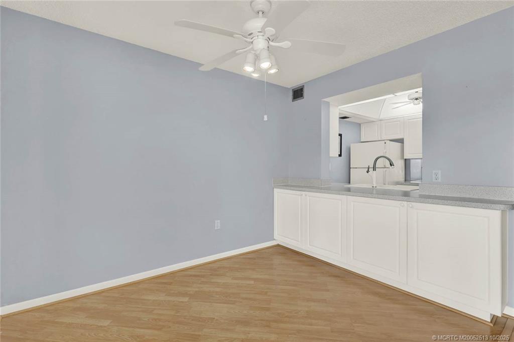 1950 Southwest Palm City Road, Unit 3207 Stuart, FL 34994 - Photo 11 of 44 a bathroom with a sink and vanity