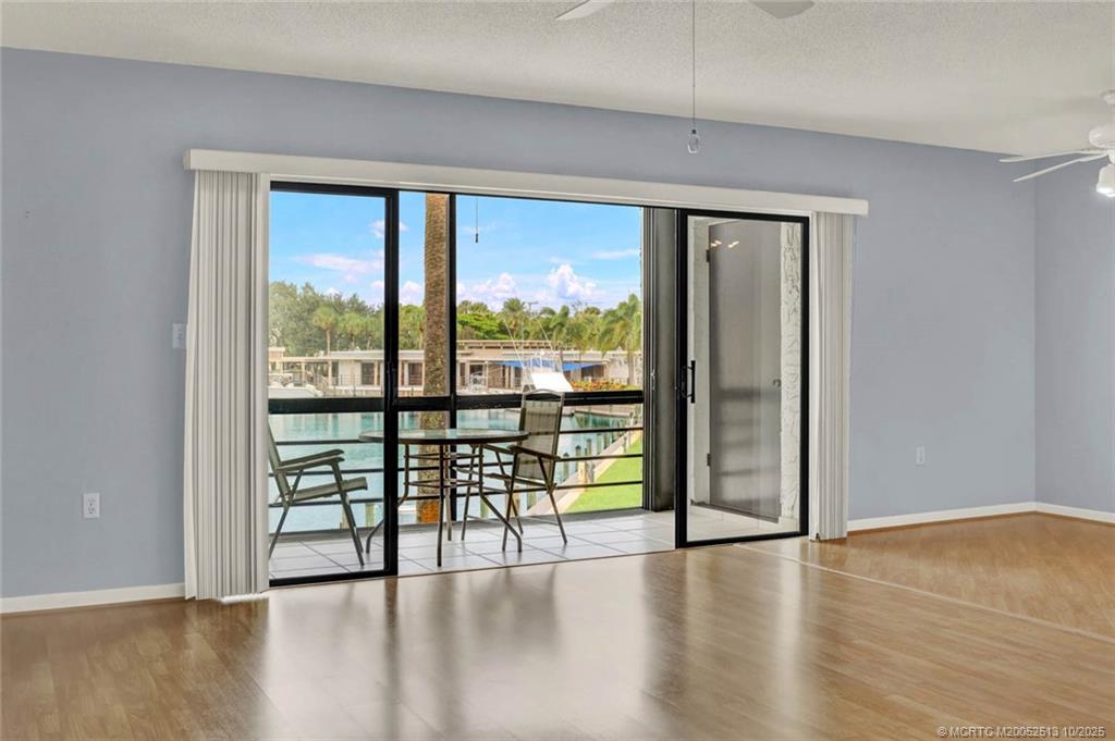 1950 Southwest Palm City Road, Unit 3207 Stuart, FL 34994 - Photo 12 of 44 a view of a livingroom with wooden floor and furniture