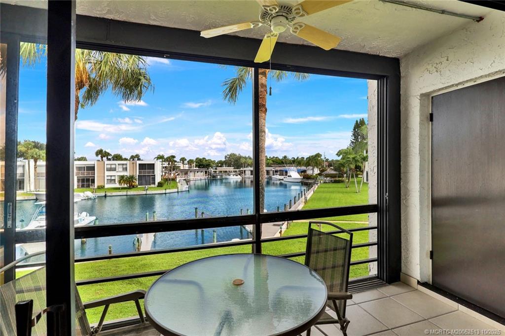 1950 Southwest Palm City Road, Unit 3207 Stuart, FL 34994 - Photo 13 of 44 a view of a glass door with a balcony