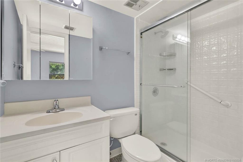 1950 Southwest Palm City Road, Unit 3207 Stuart, FL 34994 - Photo 29 of 44 a bathroom with a sink toilet and shower