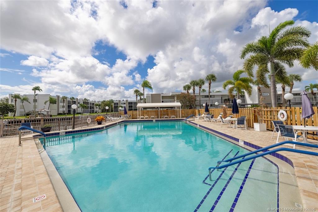 1950 Southwest Palm City Road, Unit 3207 Stuart, FL 34994 - Photo 32 of 44 a view of swimming pool from a balcony