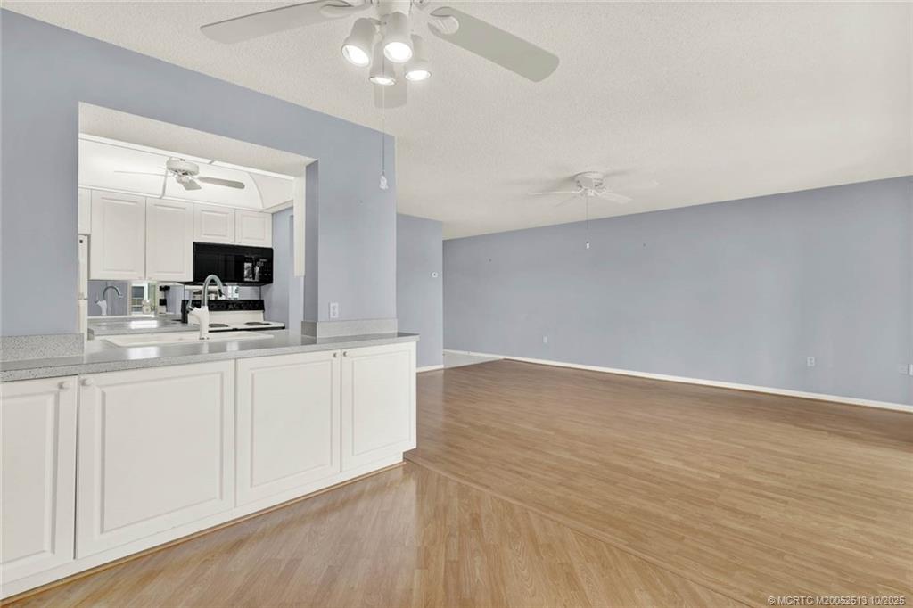 1950 Southwest Palm City Road, Unit 3207 Stuart, FL 34994 - Photo 10 of 44 a view of a kitchen with microwave and cabinets