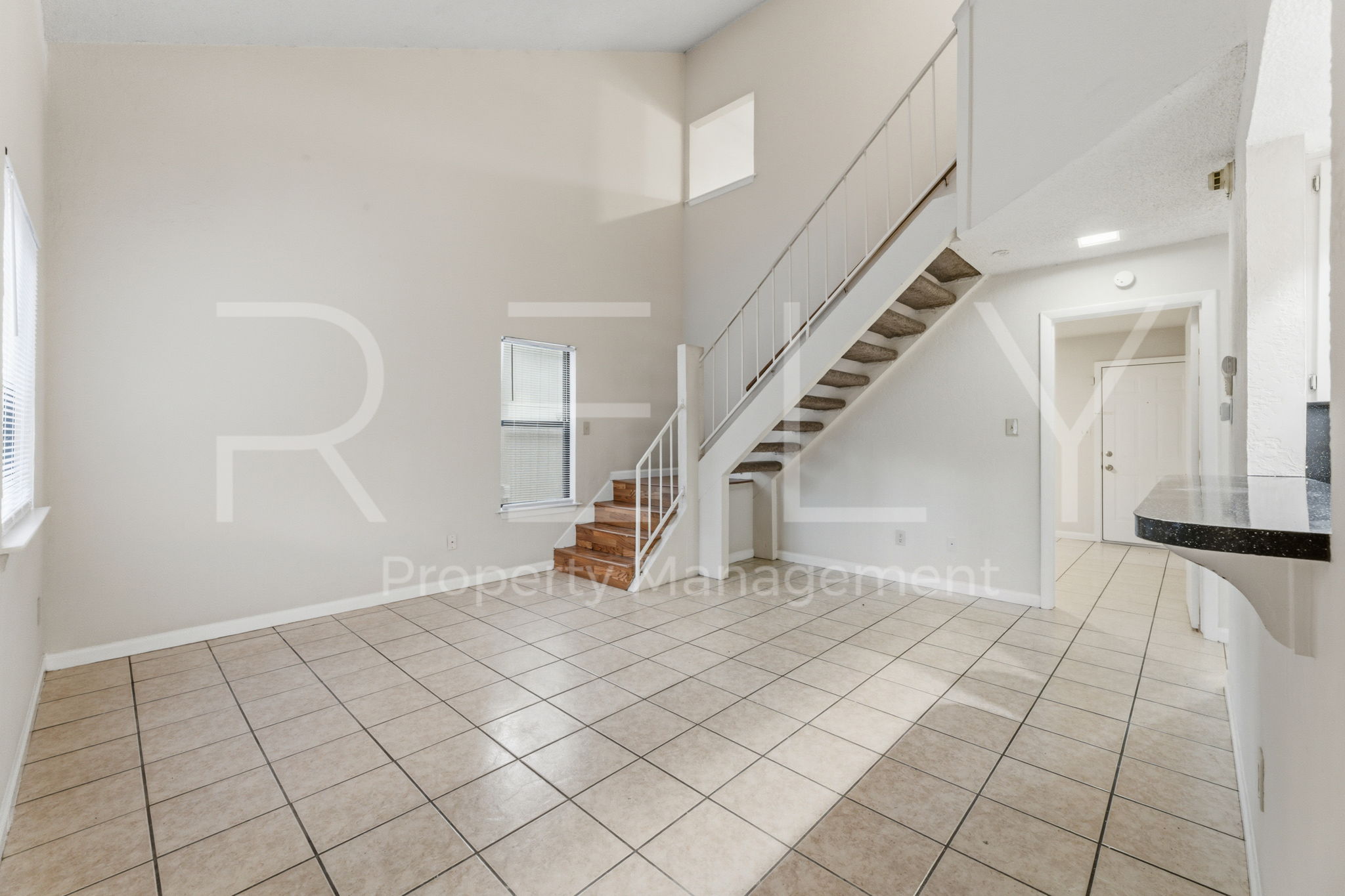 1005 Milford Way, Unit A Austin, TX 78745 - Photo 6 of 30 a view of an entryway with staircase