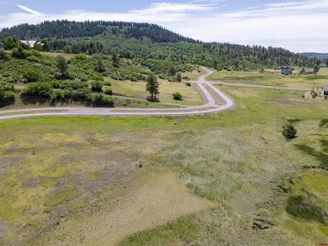 a view of a lake with a yard