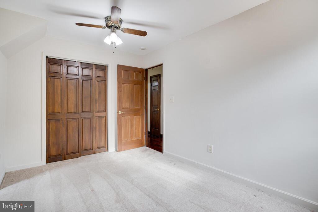 936 Grace Road Huntingtown, MD 20639 - Photo 41 of 64 a view of an empty room with a ceiling fan