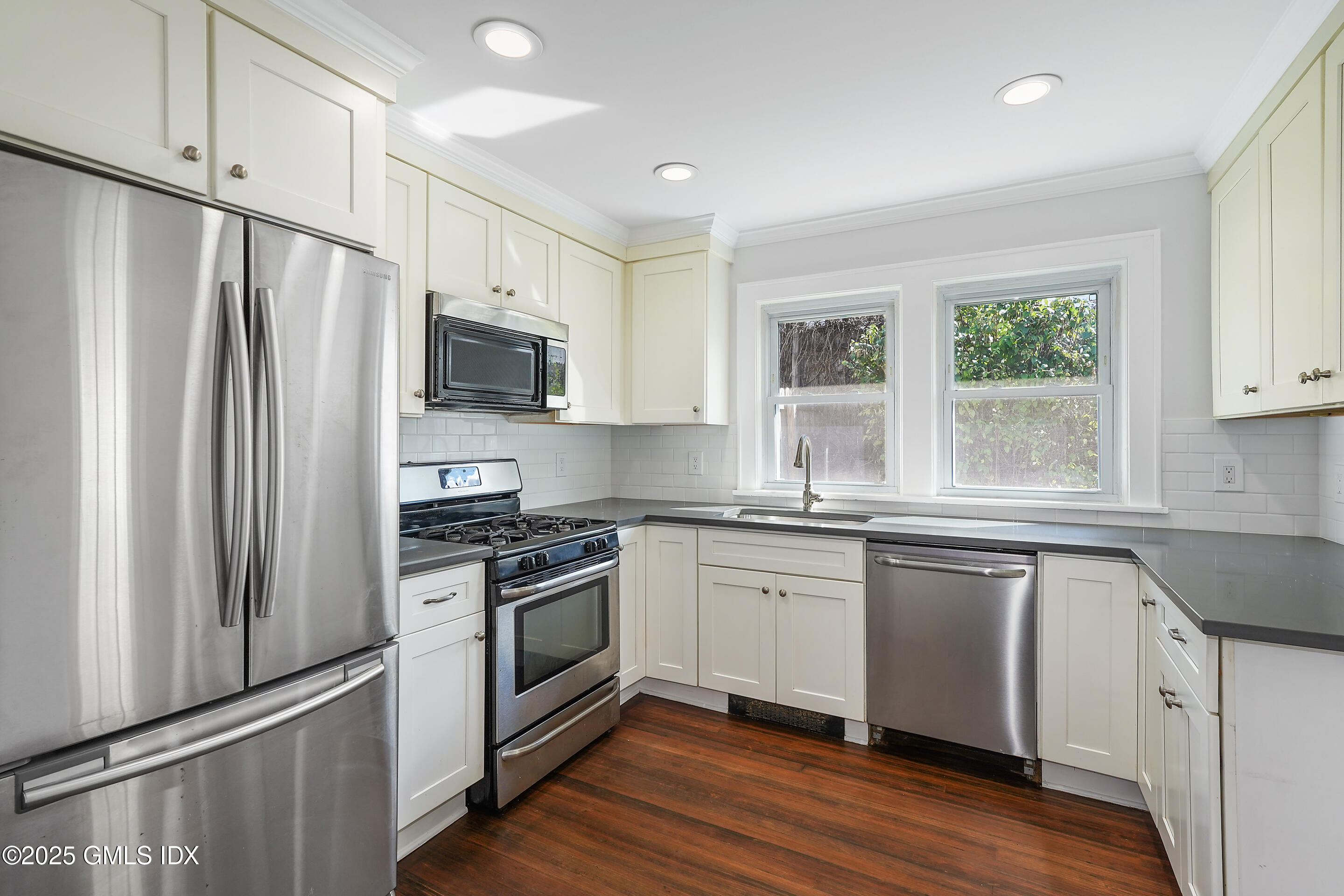 95 Byram Road Greenwich, CT 06830 - Photo 12 of 35 a kitchen with granite countertop a refrigerator stove top oven and sink