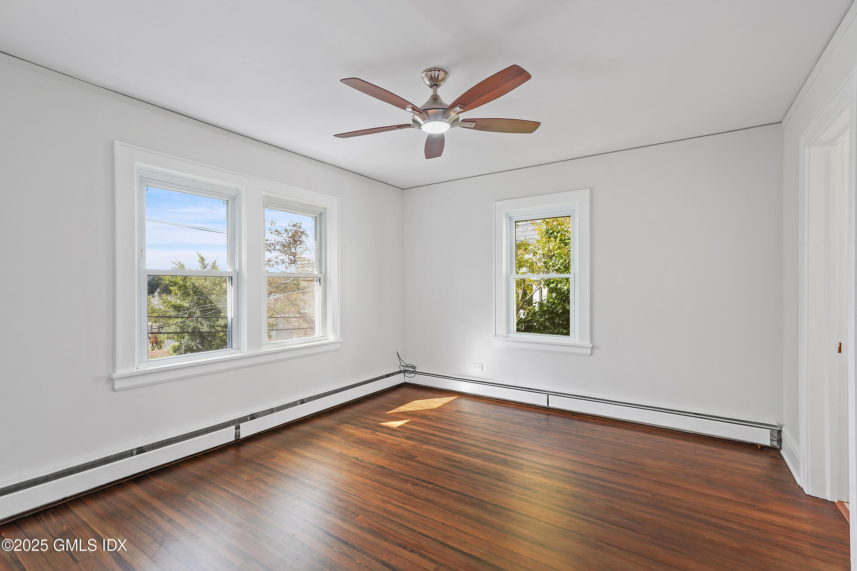 95 Byram Road Greenwich, CT 06830 - Photo 15 of 35 a view of a big room with wooden floor and windows