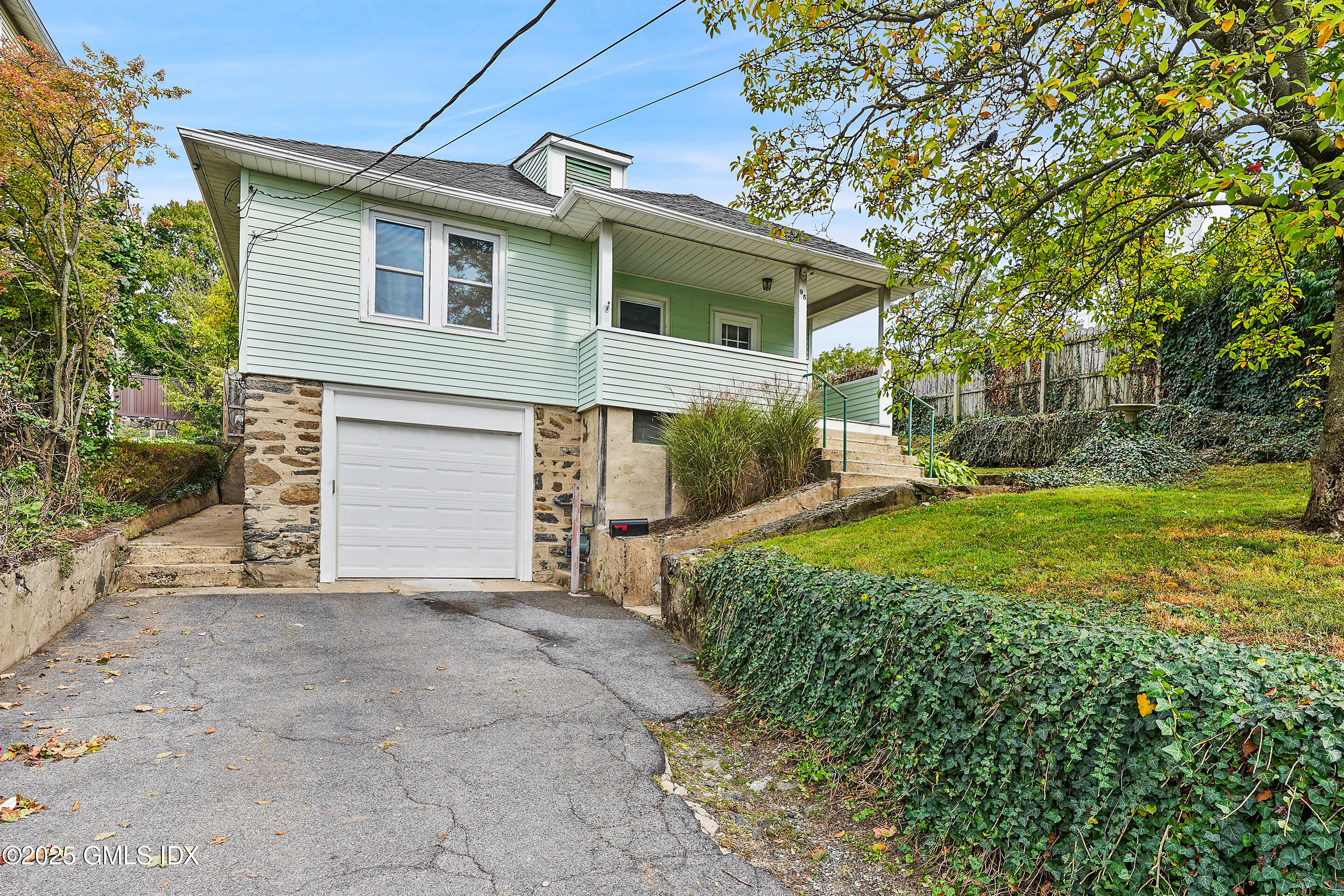 95 Byram Road Greenwich, CT 06830 - Photo 2 of 35 front view of a house with yard