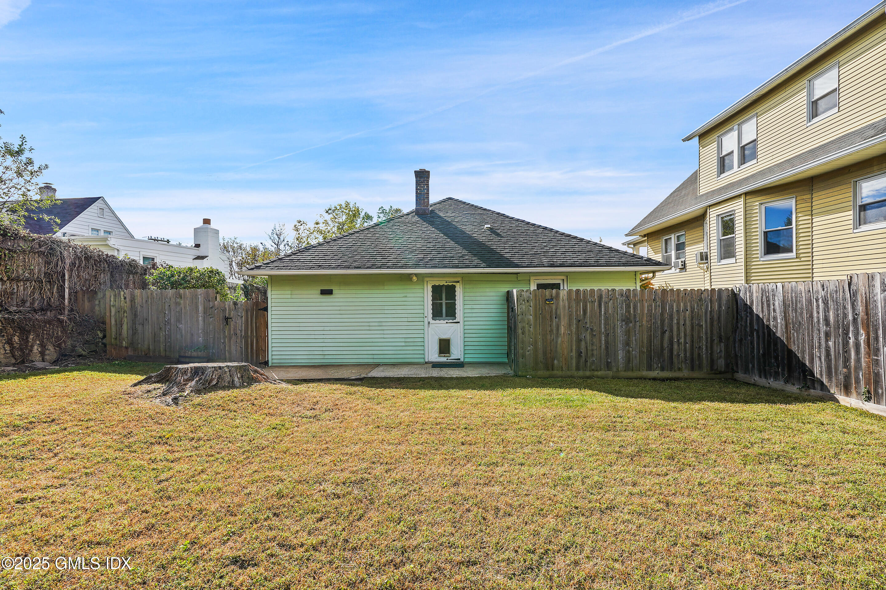 95 Byram Road Greenwich, CT 06830 - Photo 28 of 35 a front view of a house with a yard