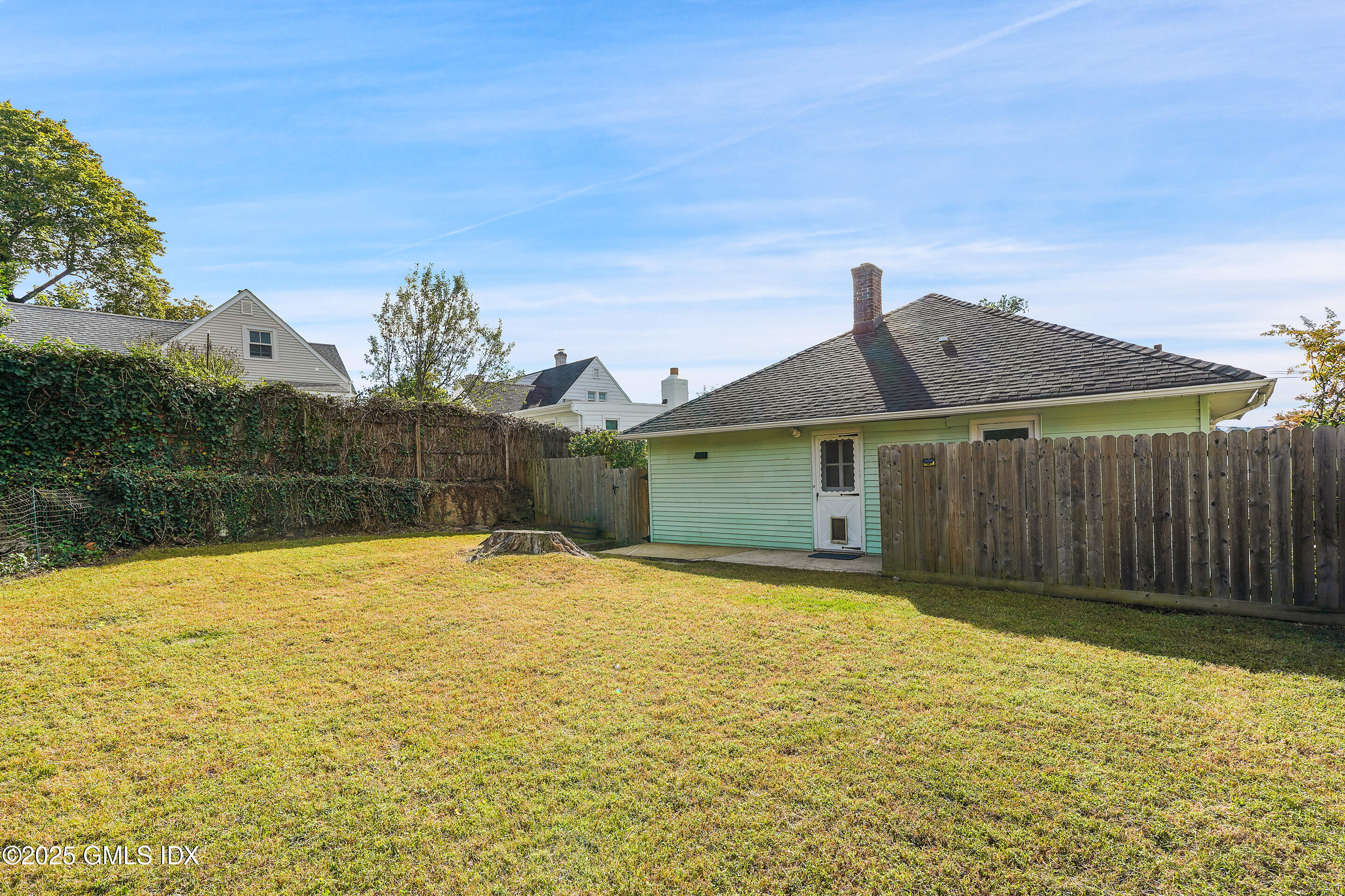 95 Byram Road Greenwich, CT 06830 - Photo 29 of 35 a front view of a house having yard