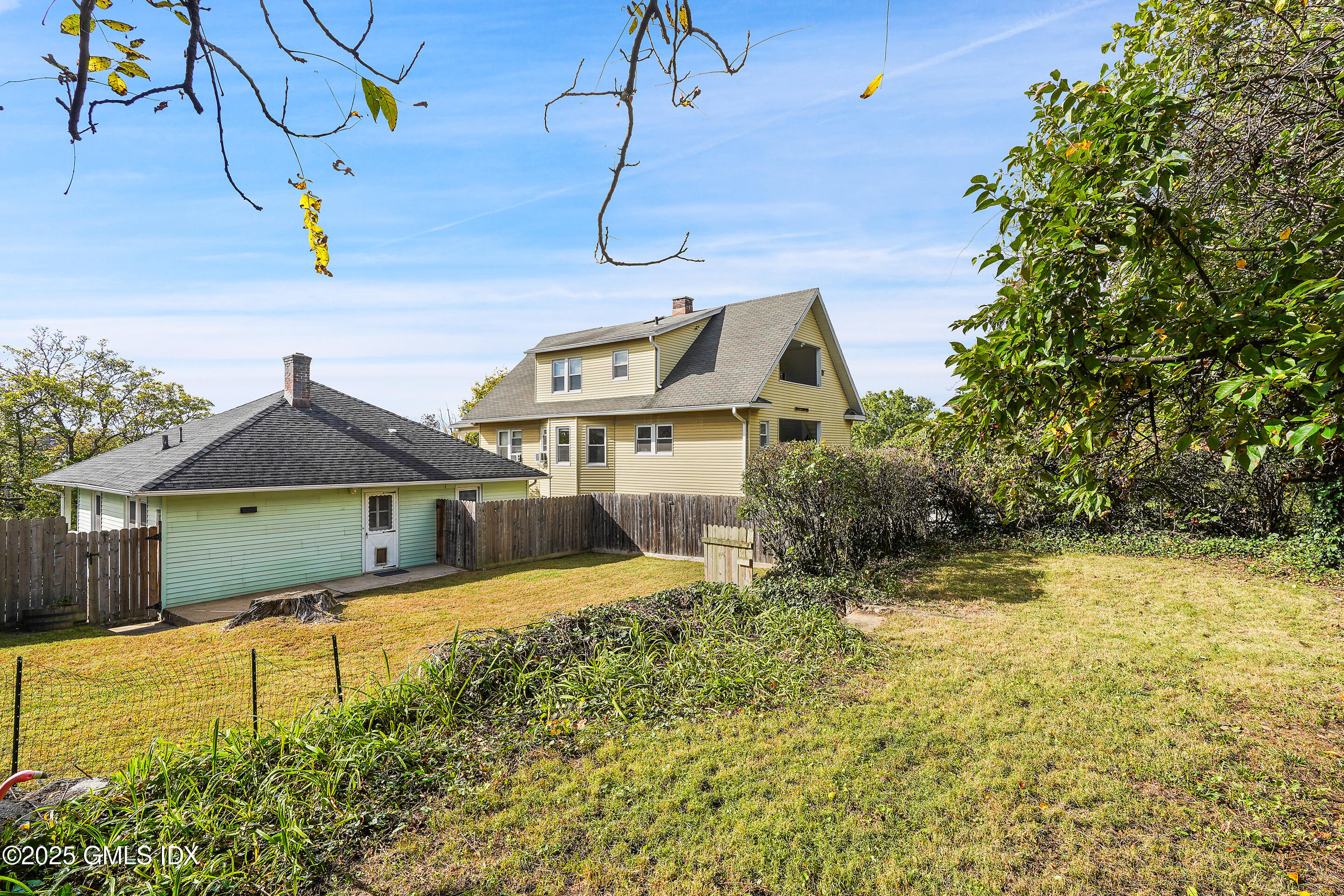 95 Byram Road Greenwich, CT 06830 - Photo 30 of 35 a view of a house with a yard
