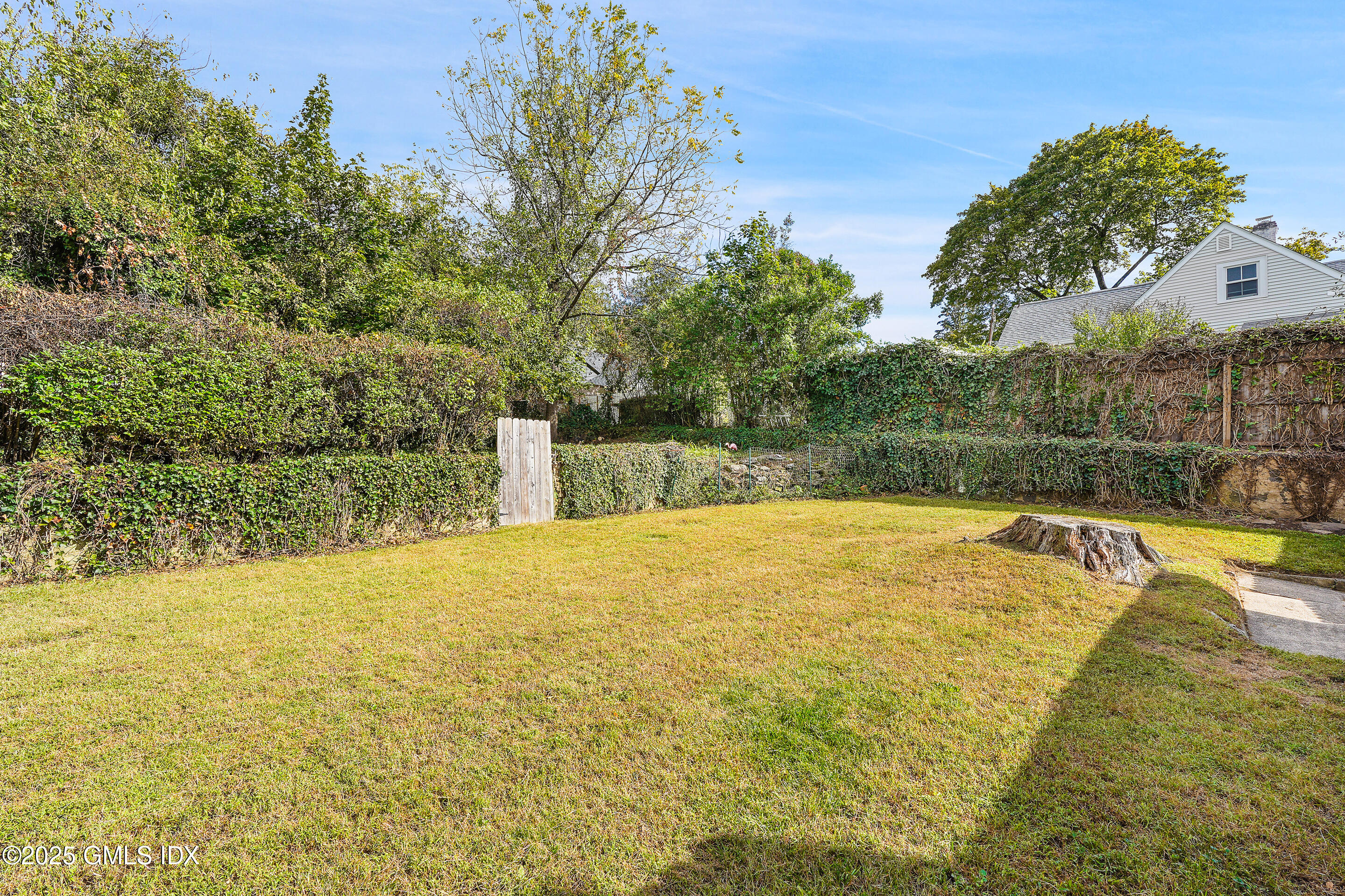 95 Byram Road Greenwich, CT 06830 - Photo 32 of 35 a view of a swimming pool and trees