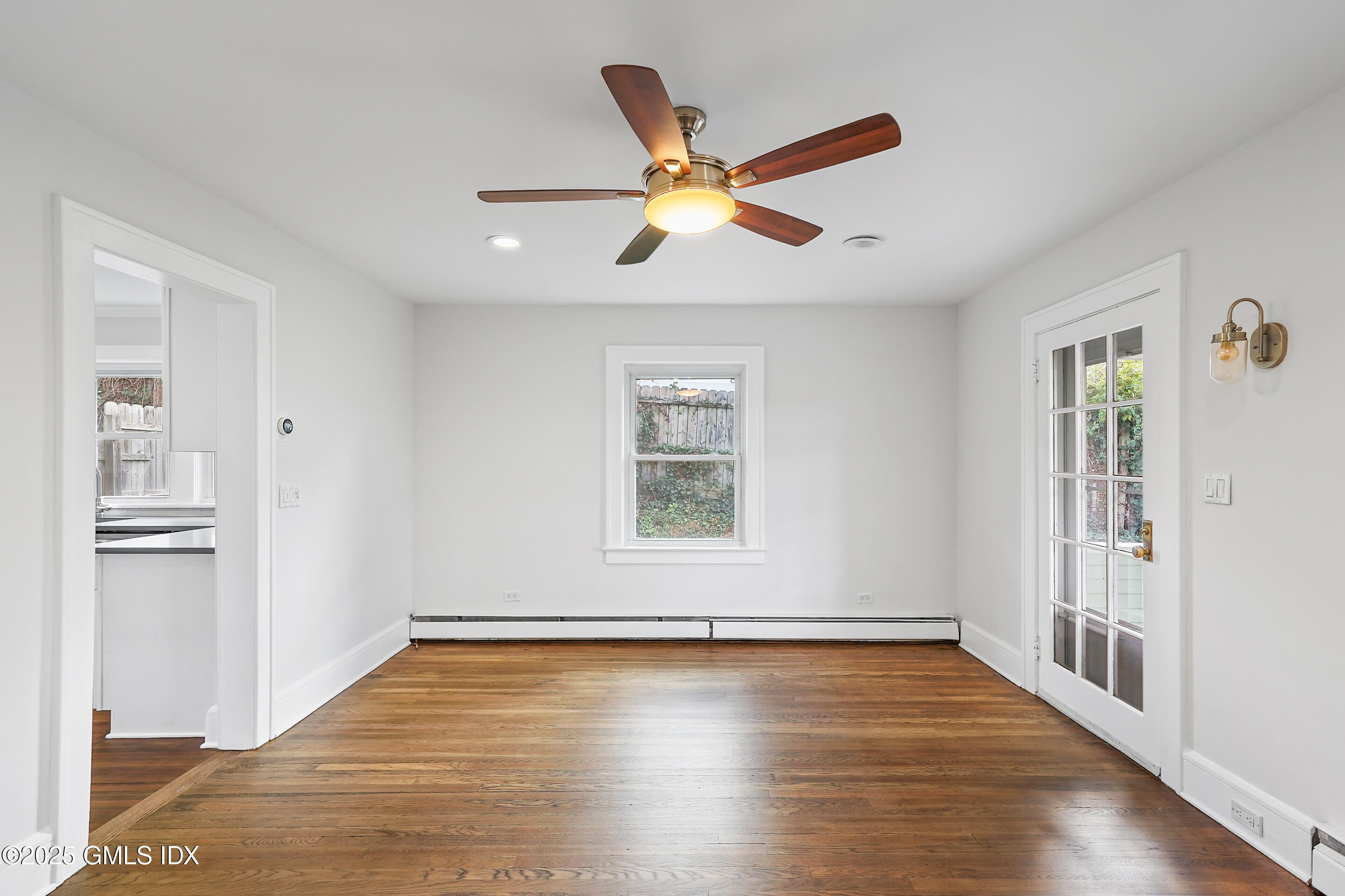 95 Byram Road Greenwich, CT 06830 - Photo 5 of 35 a view of empty room with wooden floor and fan