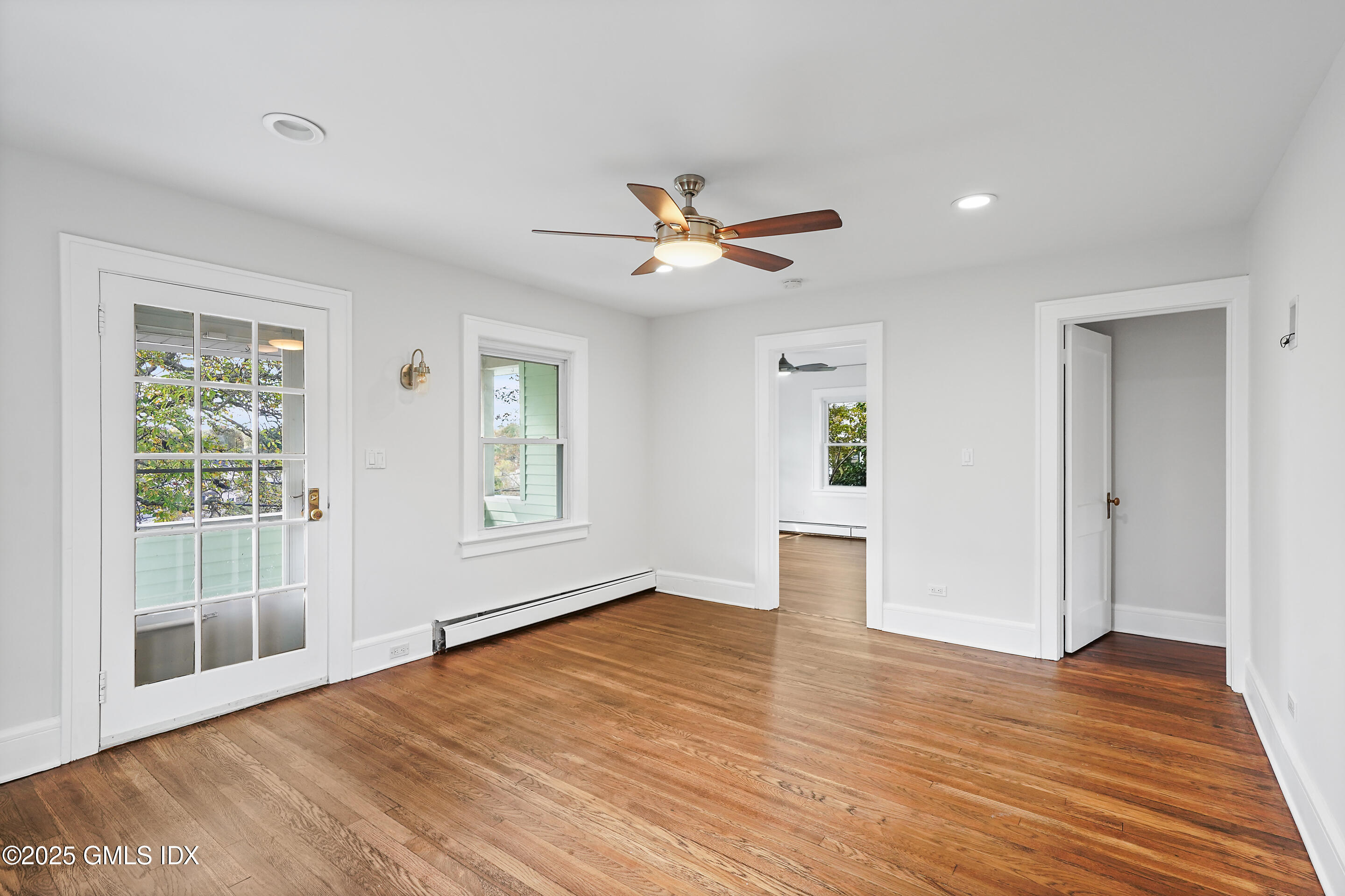 95 Byram Road Greenwich, CT 06830 - Photo 6 of 35 a view of empty room with wooden floor and fan