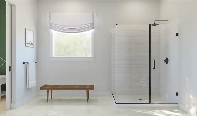 a bathroom with a window and a shower