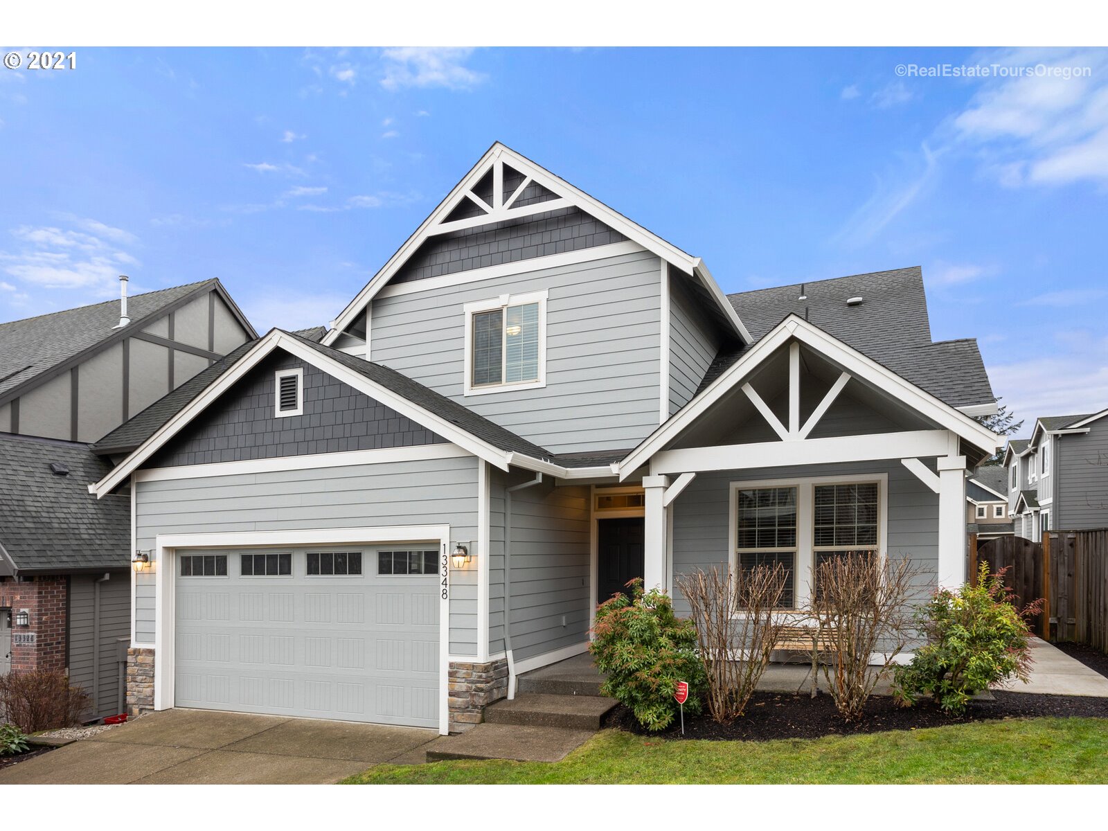 13348 Southwest Alpine View Tigard, OR 97224 - Photo 2 of 32 a front view of a house with a yard