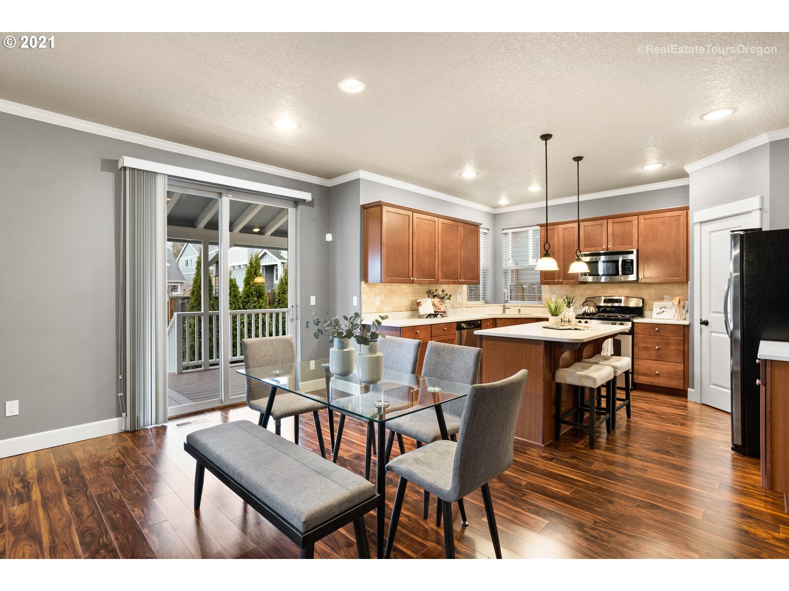 13348 Southwest Alpine View Tigard, OR 97224 - Photo 11 of 32 a dining room with stainless steel appliances kitchen island granite countertop a dining table chairs and view living room