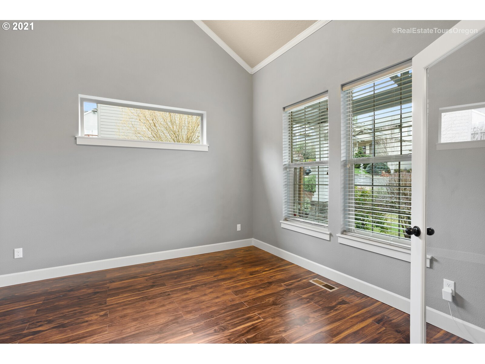 13348 Southwest Alpine View Tigard, OR 97224 - Photo 14 of 32 a view of an empty room with wooden floor and a window