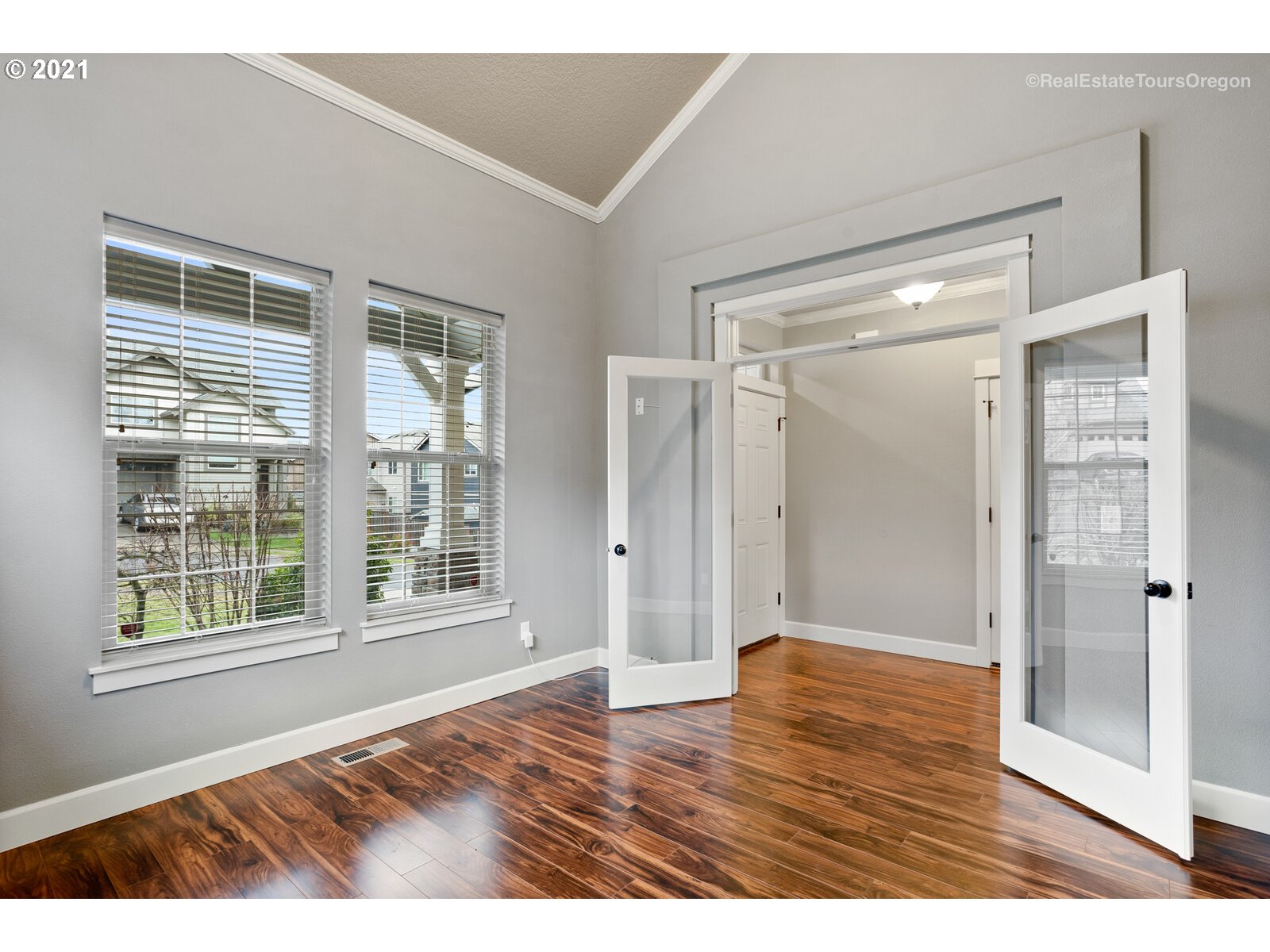 13348 Southwest Alpine View Tigard, OR 97224 - Photo 15 of 32 a view of an empty room with wooden floor and a window