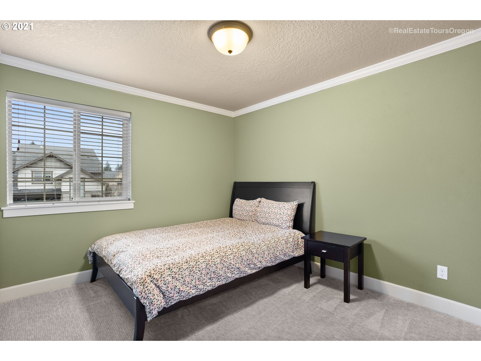 13348 Southwest Alpine View Tigard, OR 97224 - Photo 23 of 32 a bedroom with a bed and window