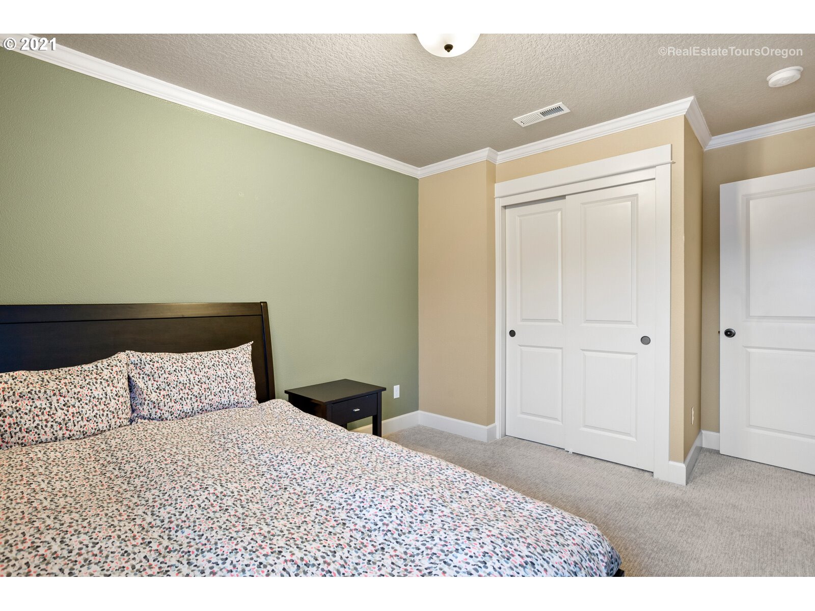 13348 Southwest Alpine View Tigard, OR 97224 - Photo 24 of 32 a bedroom with a bed and a night stand