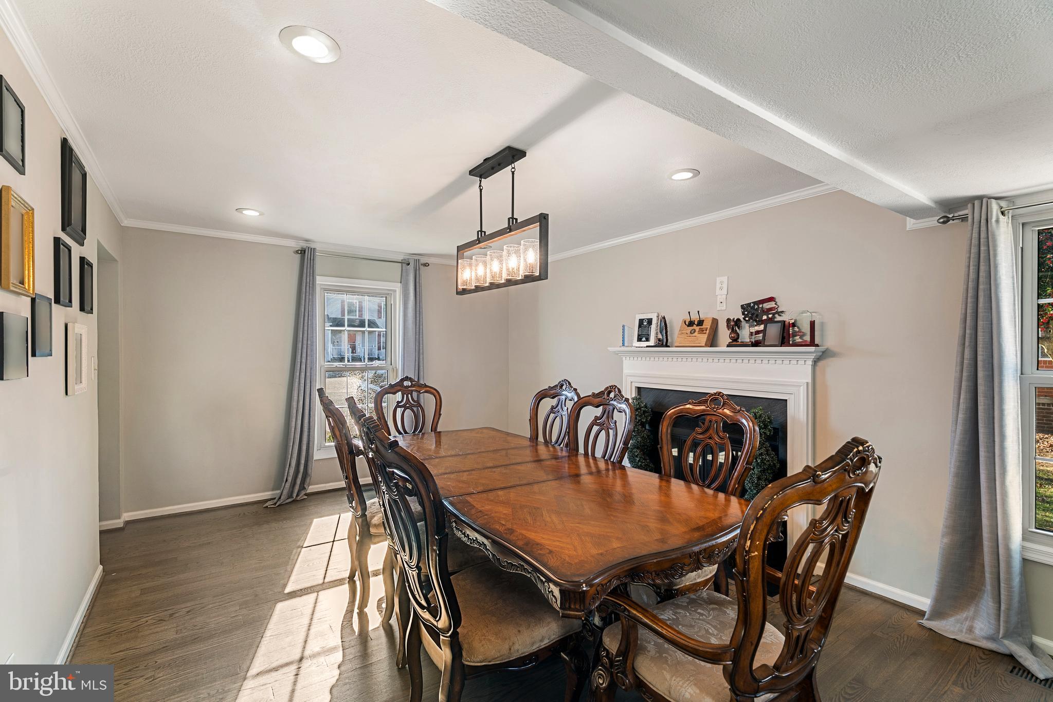 3100 Franklin Street Alexandria, VA 22306 - Photo 14 of 55 a view of a dining room and livingroom with furniture wooden floor a rug a painting and a chandelier