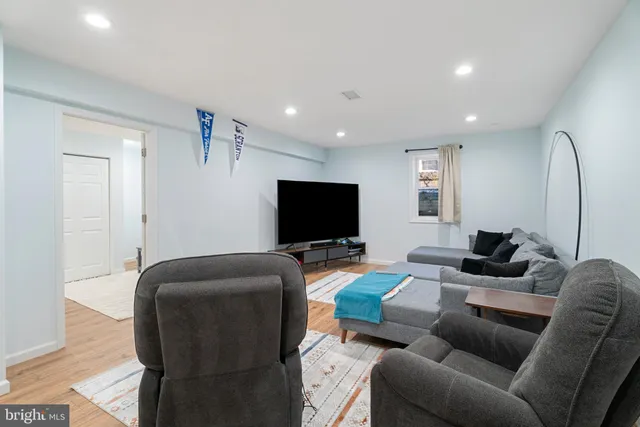 a bedroom with a bed and a ceiling fan