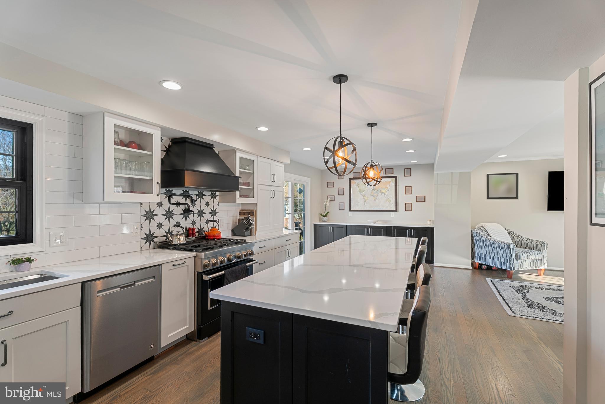 3100 Franklin Street Alexandria, VA 22306 - Photo 9 of 55 a kitchen with a sink a stove a microwave and cabinets
