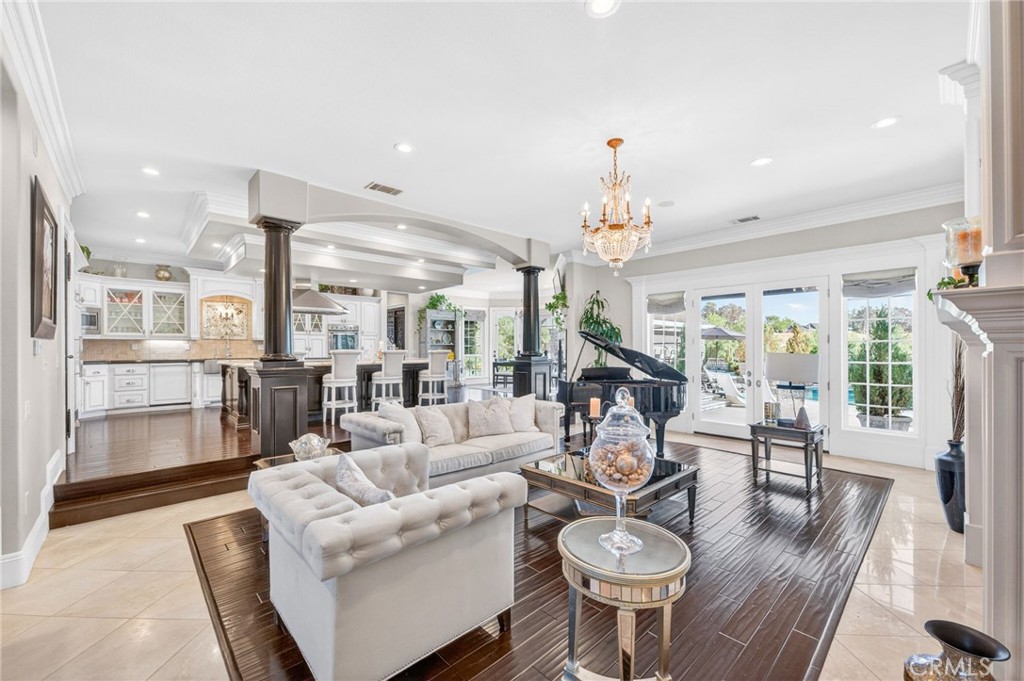 41515 Vía Del Monte Temecula, CA 92592 - Photo 13 of 64 a living room with furniture a chandelier and a dining table