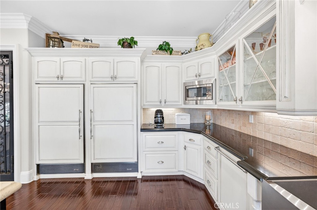 41515 Vía Del Monte Temecula, CA 92592 - Photo 15 of 64 a kitchen with granite countertop white cabinets and white appliances