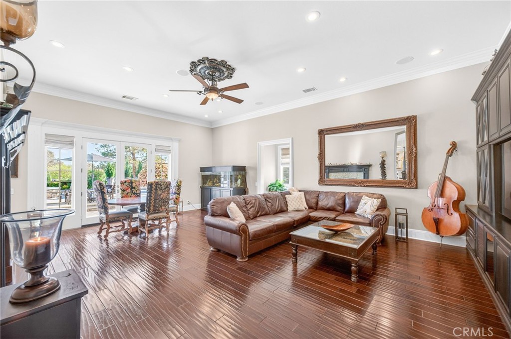 41515 Vía Del Monte Temecula, CA 92592 - Photo 20 of 64 a living room with furniture and a wooden floor