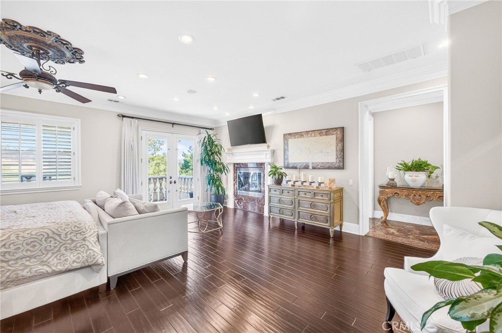 41515 Vía Del Monte Temecula, CA 92592 - Photo 27 of 64 a living room with furniture wooden floor and a large window