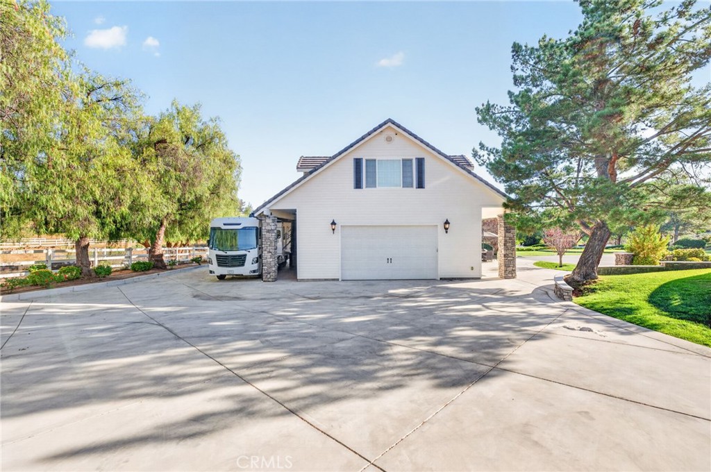 41515 Vía Del Monte Temecula, CA 92592 - Photo 43 of 64 a view of a house with a yard and garage