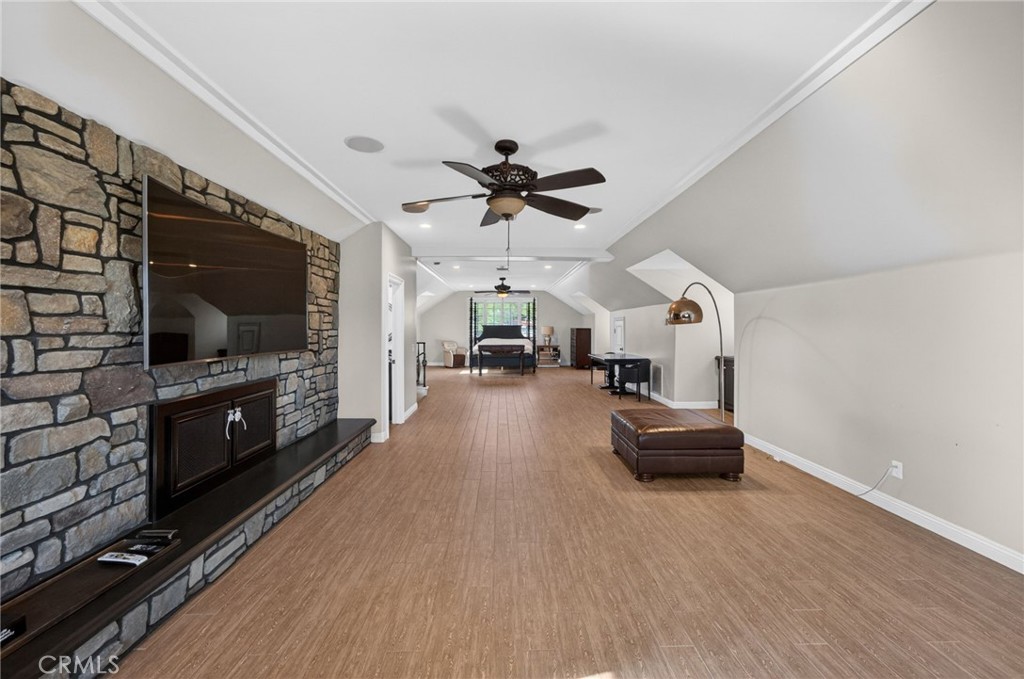 41515 Vía Del Monte Temecula, CA 92592 - Photo 49 of 64 a living room with furniture and a flat screen tv