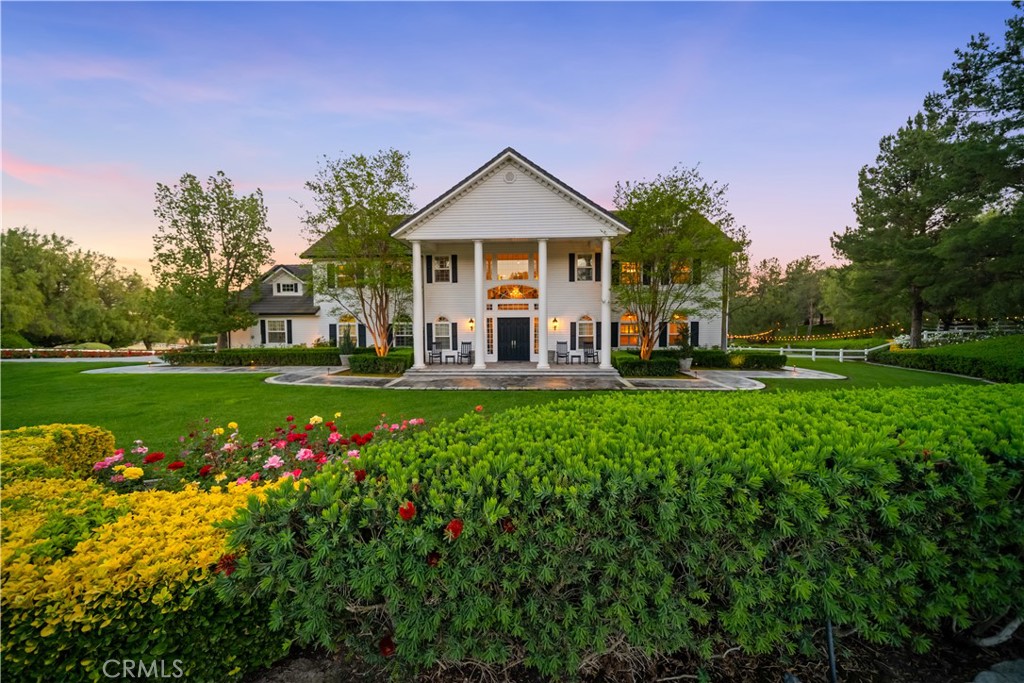 41515 Vía Del Monte Temecula, CA 92592 - Photo 63 of 64 a front view of a house with a yard and trees