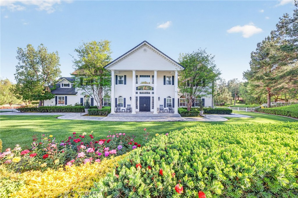 41515 Vía Del Monte Temecula, CA 92592 - Photo 7 of 64 a view of a house with a big yard and potted plants