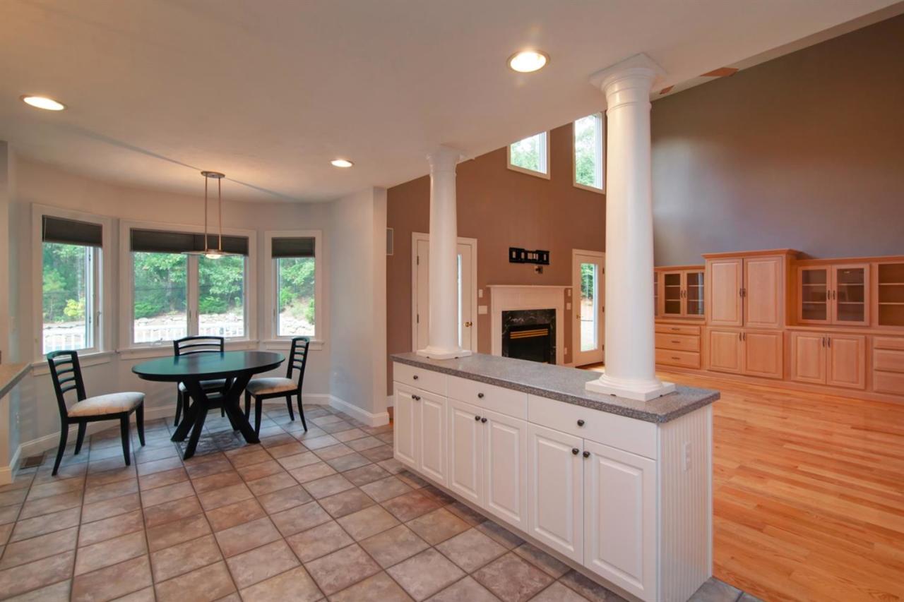 153 Cairn Ridge Road East Falmouth, MA 02536 - Photo 11 of 25 a kitchen with cabinets table and chairs