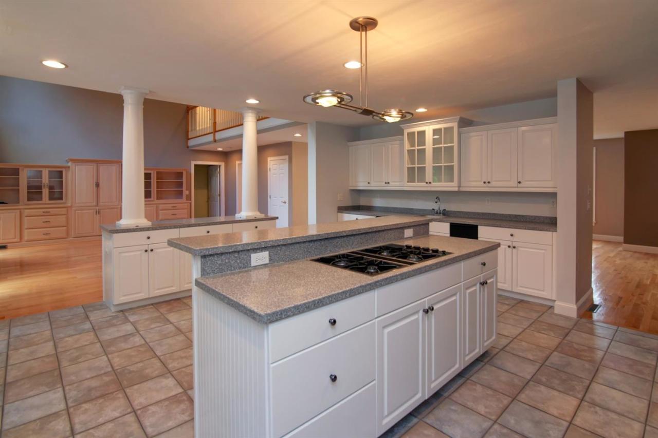 153 Cairn Ridge Road East Falmouth, MA 02536 - Photo 12 of 25 a kitchen that has a sink a stove and a microwave
